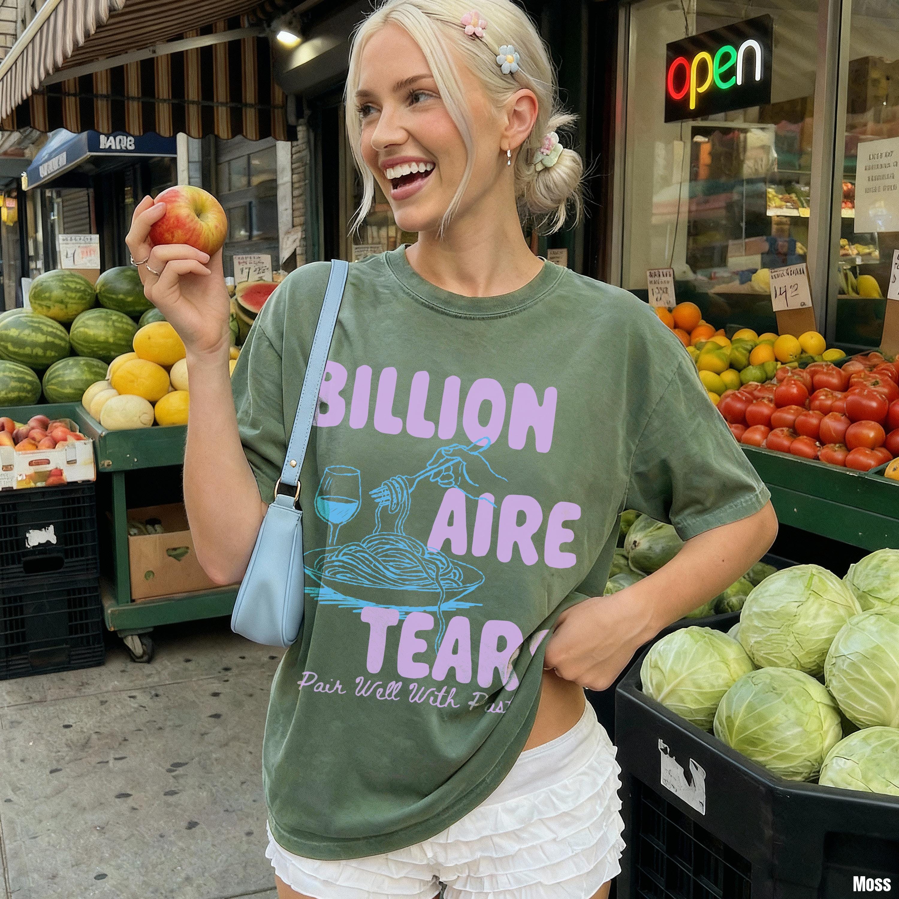 Green t-shirt with &amp;quot;BILLIONAIRE TEAR&amp;quot; text and spaghetti graphic with a happy woman.
