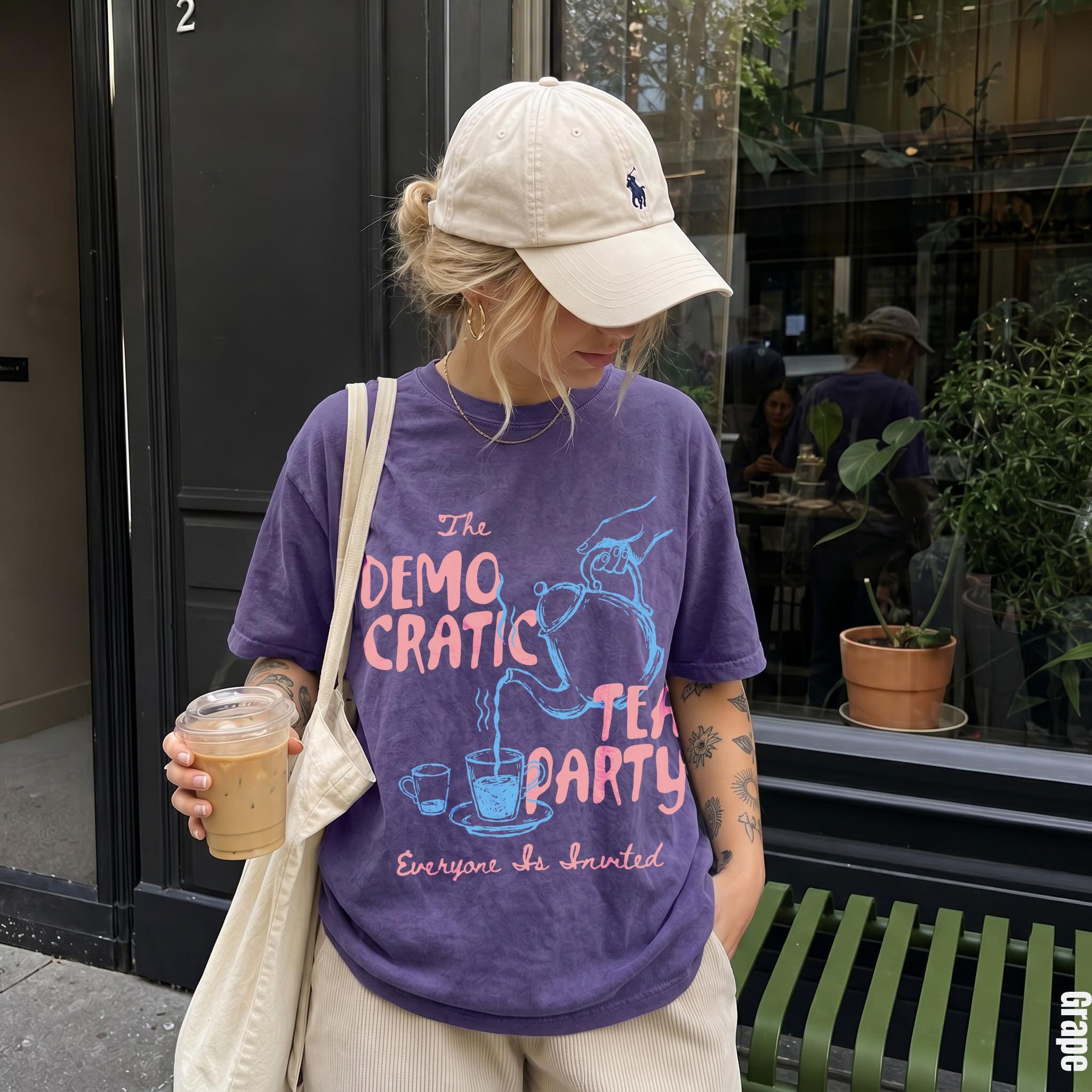 Purple t-shirt with &amp;quot;The Democratic Tea Party Everyone Is Invited&amp;quot; text and teapots.
