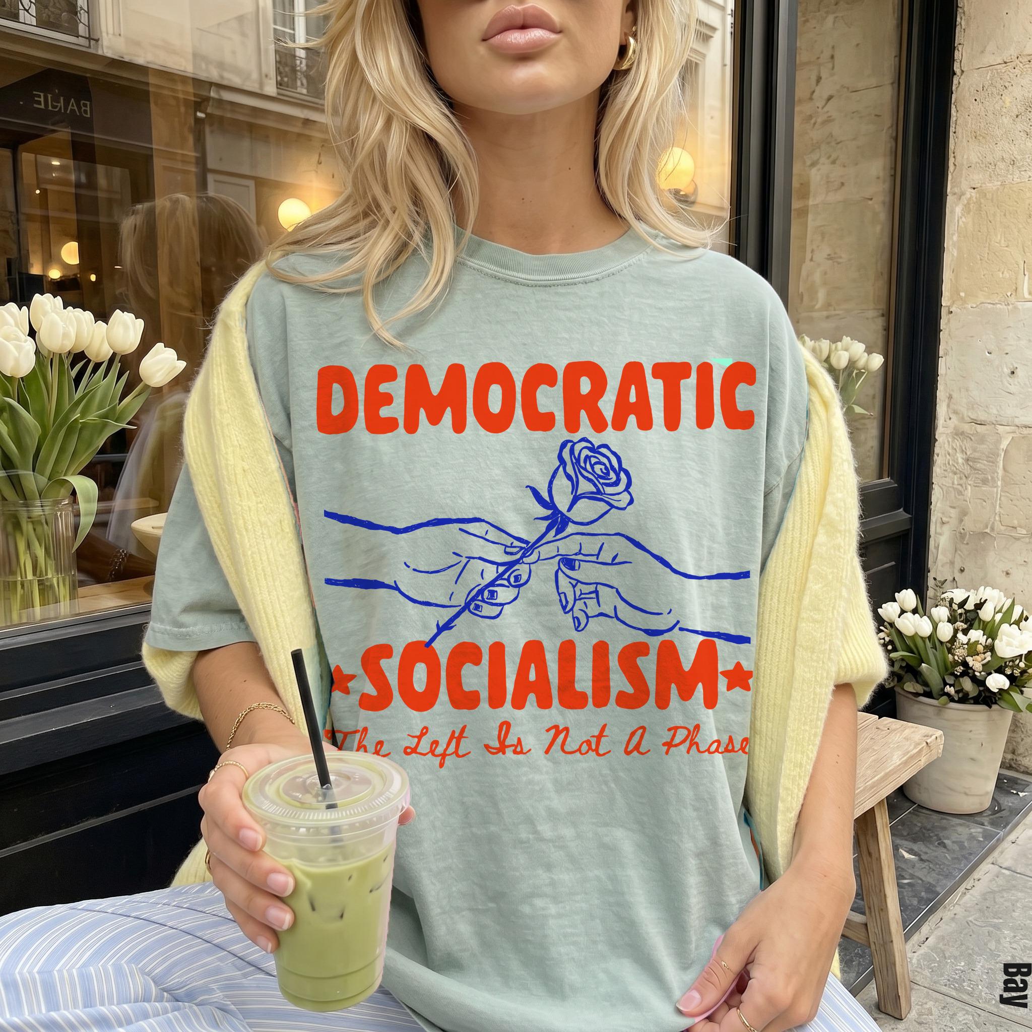 Light teal shirt with &amp;quot;Democratic Socialism&amp;quot; and rose graphic.
