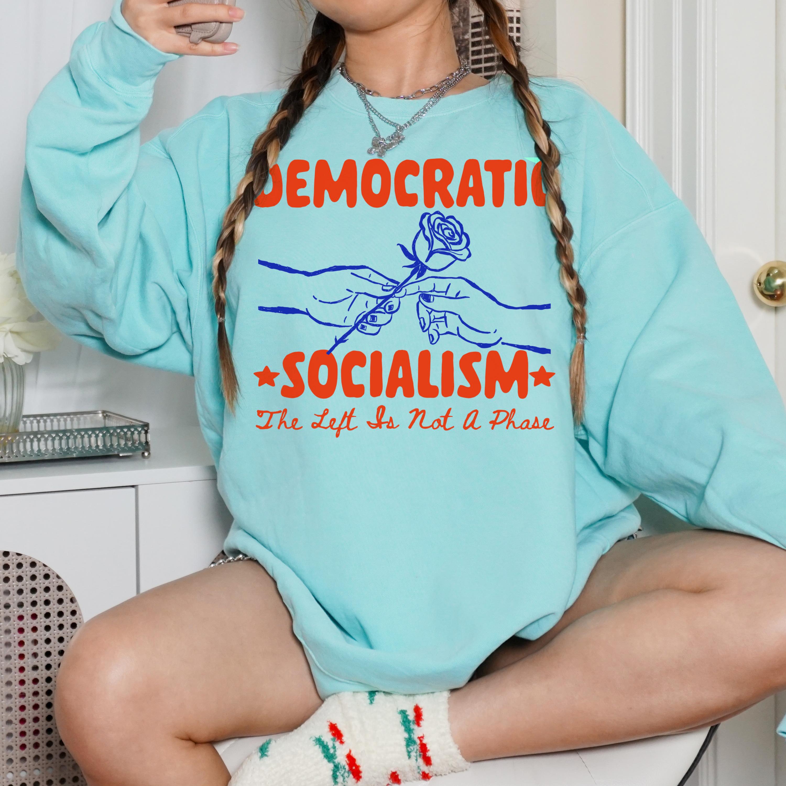 Teal sweatshirt with &amp;quot;DEMOCRATIC SOCIALISM&amp;quot; and rose graphic.