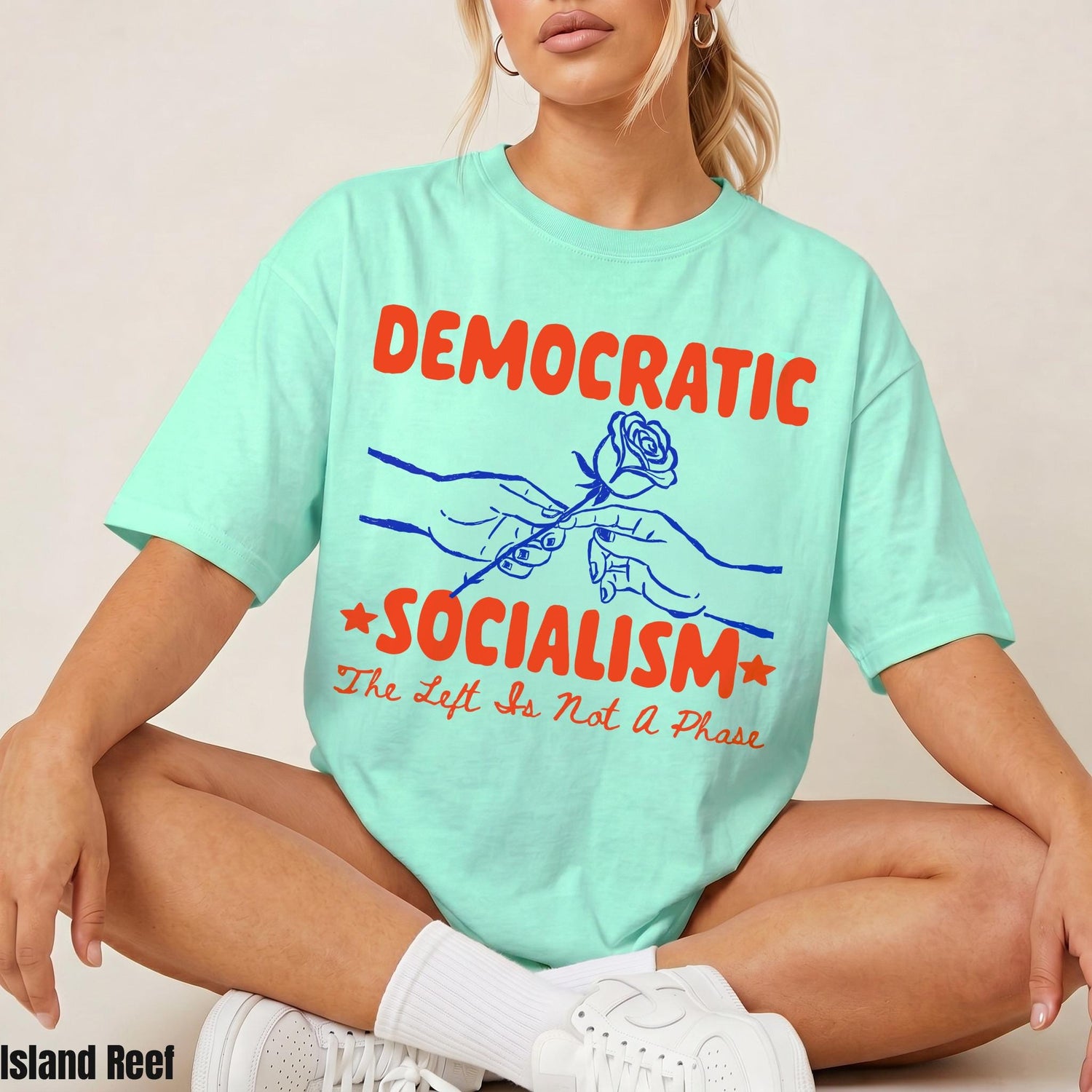 Mint t-shirt with &amp;quot;Democratic Socialism | The Left Is Not A Phase&amp;quot; text and floral graphic.