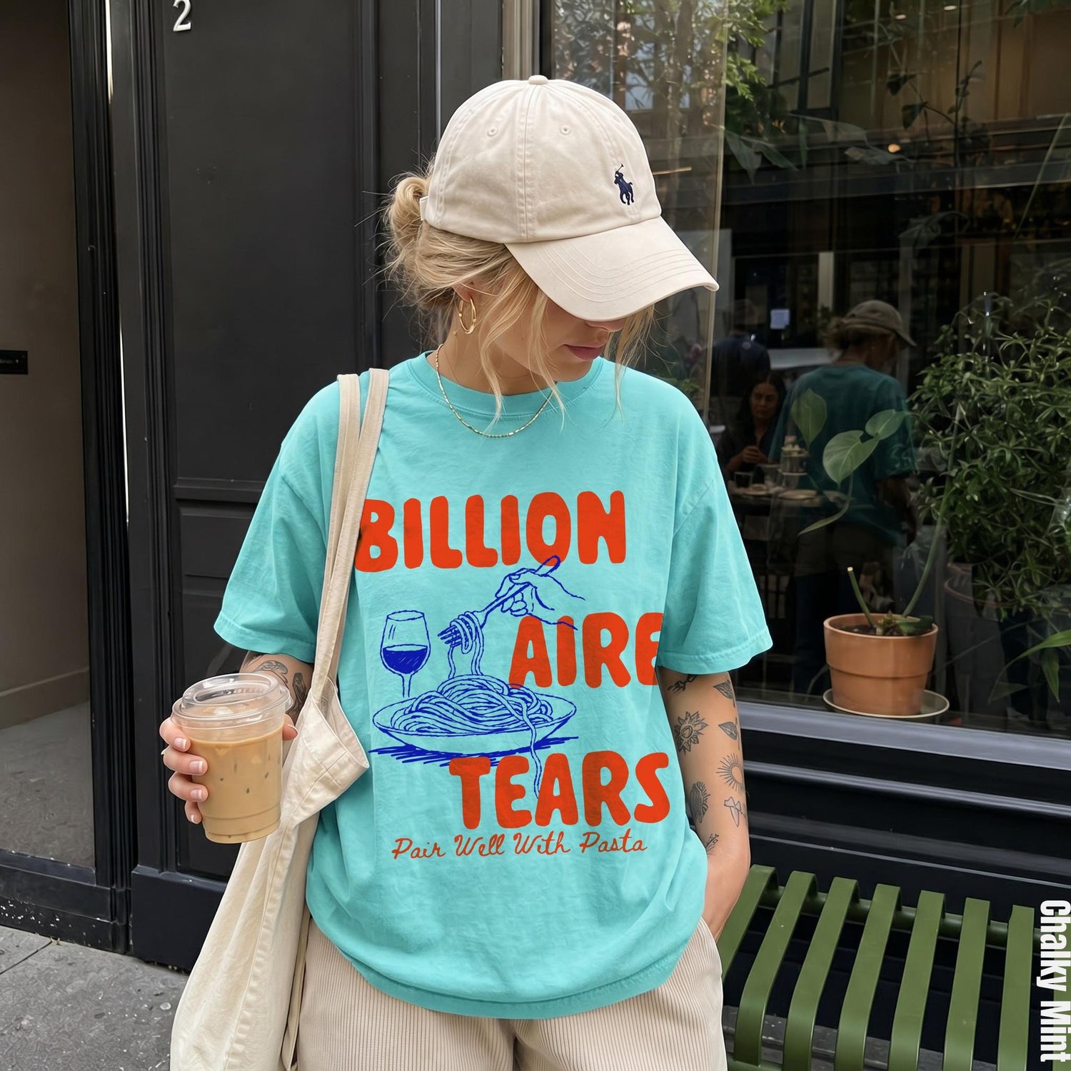 Turquoise t-shirt with &amp;quot;Billionaire Tears Pair Well With Pasta&amp;quot; graphic.