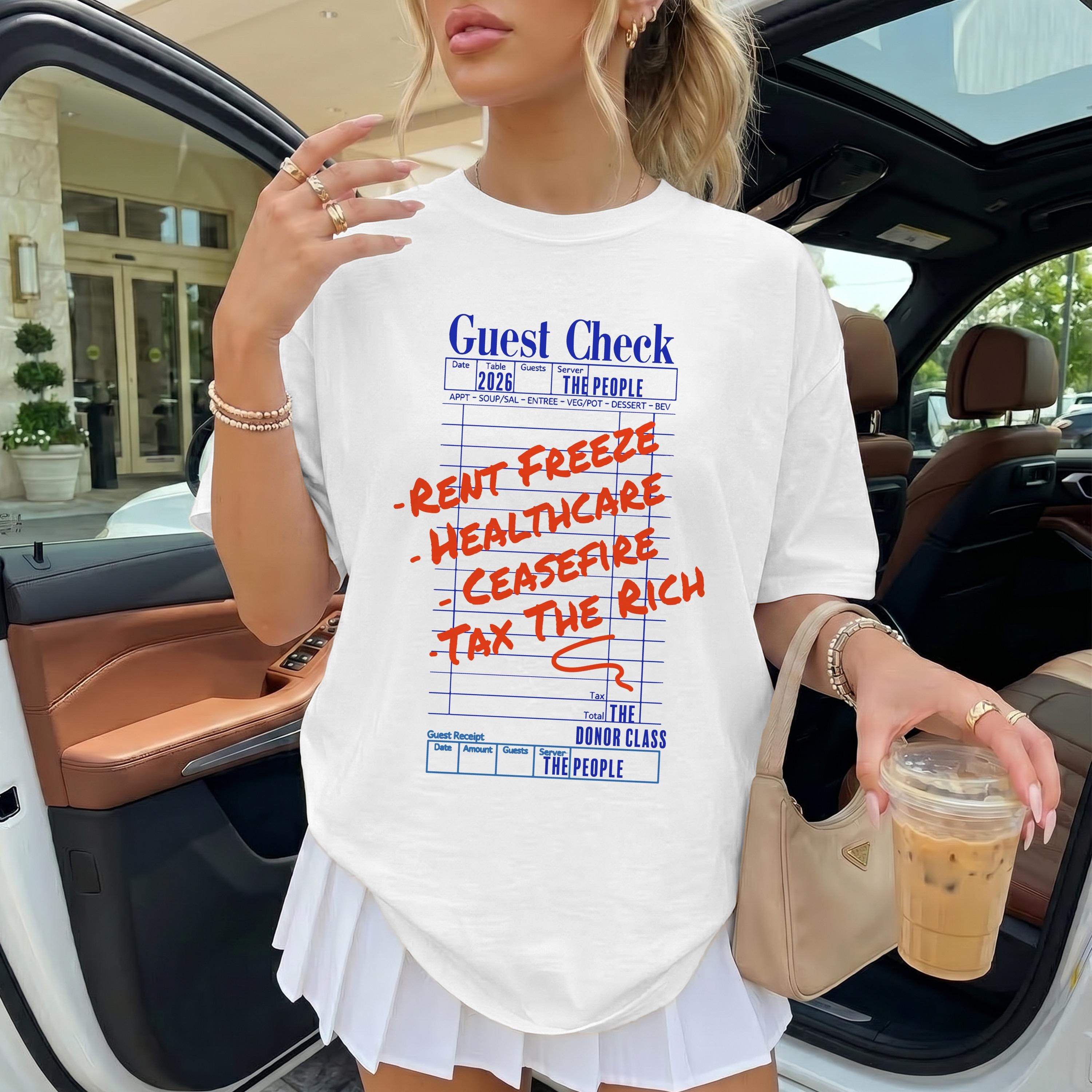 White t-shirt with &amp;quot;Guest Check&amp;quot; design listing &amp;quot;Rent Freeze,&amp;quot; &amp;quot;Healthcare,&amp;quot; &amp;quot;Ceasefire,&amp;quot; &amp;quot;Tax The Rich.&amp;quot;