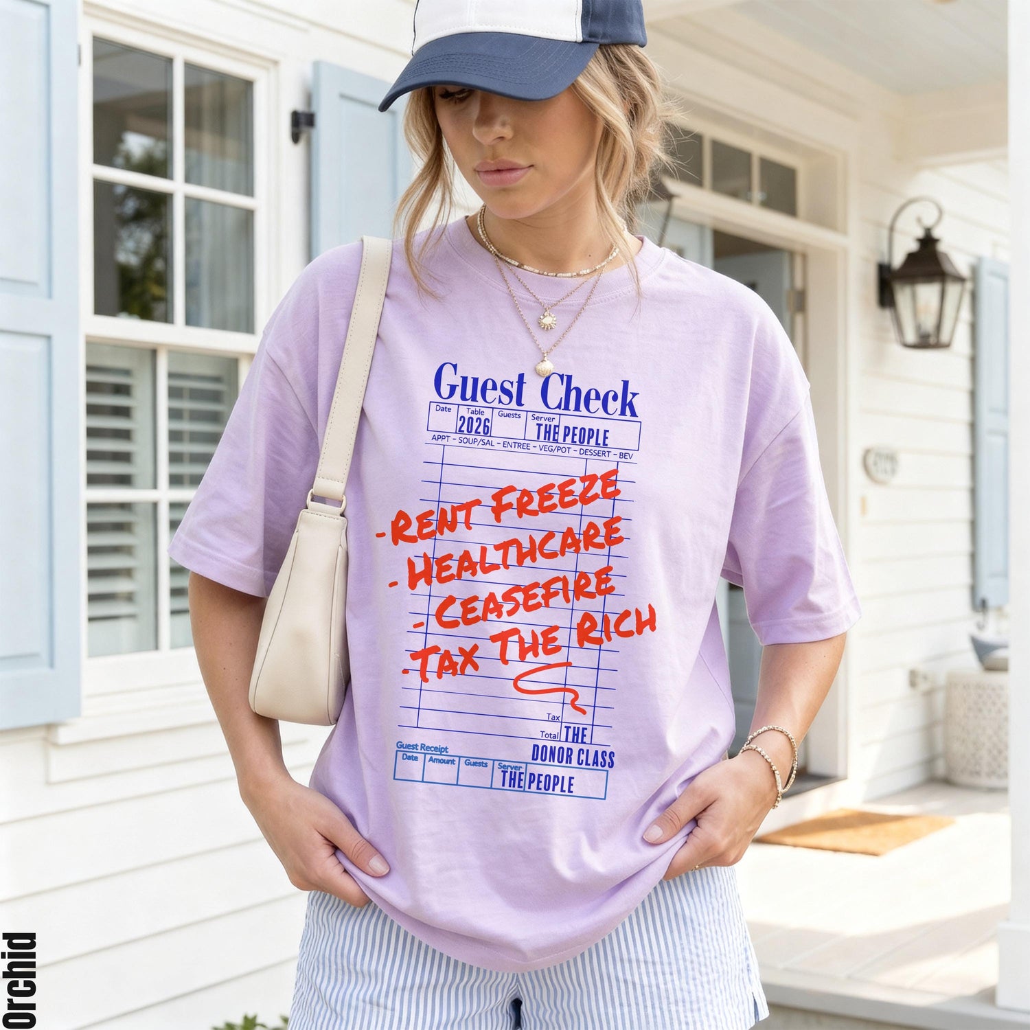 Light purple t-shirt with &amp;quot;Guest Check&amp;quot; text and &amp;quot;Rent Freeze Healthcare Ceasefire Tax The Rich&amp;quot; list.