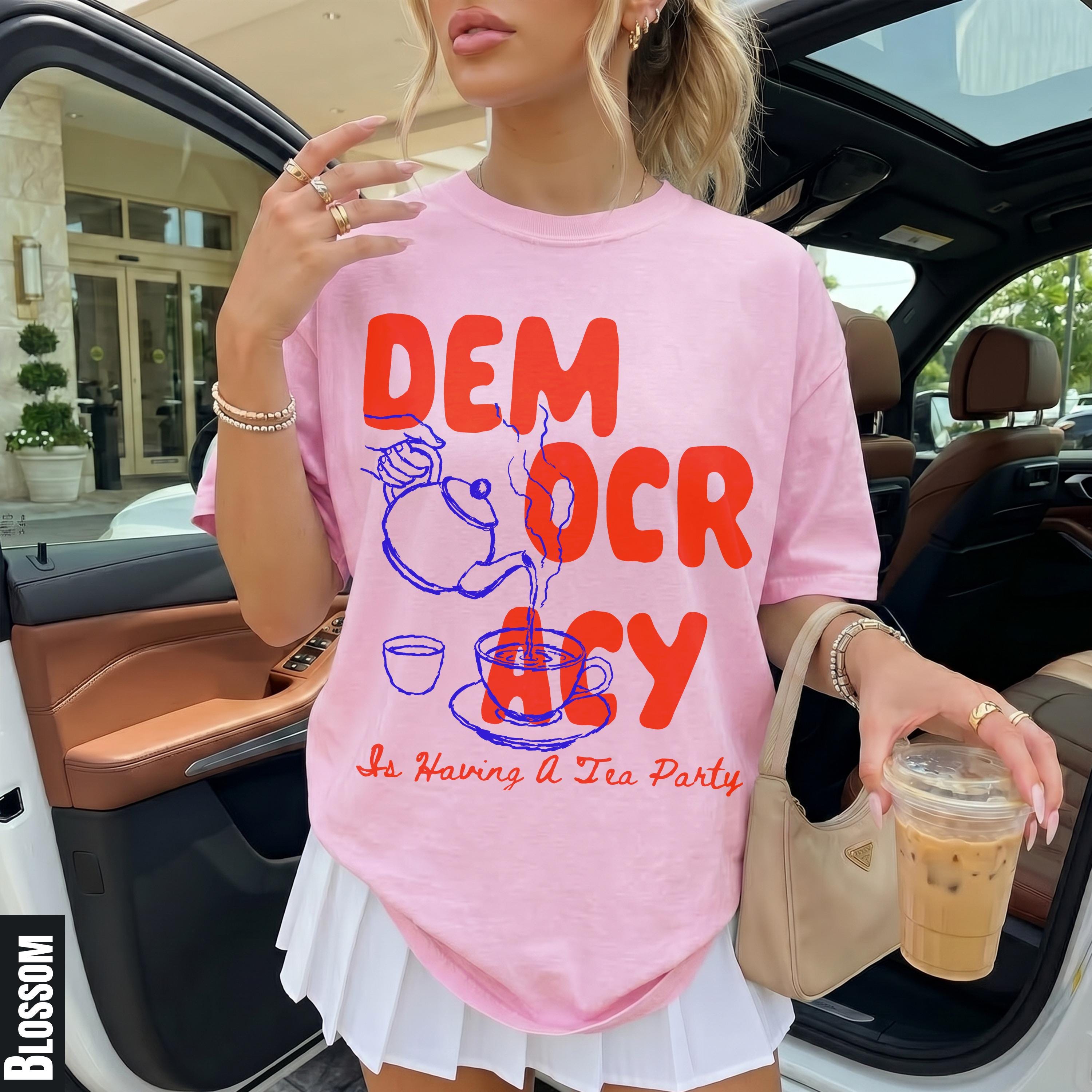 Pink t-shirt with red &amp;quot;DEMOCRACY is Having A Tea Party&amp;quot; graphic.
