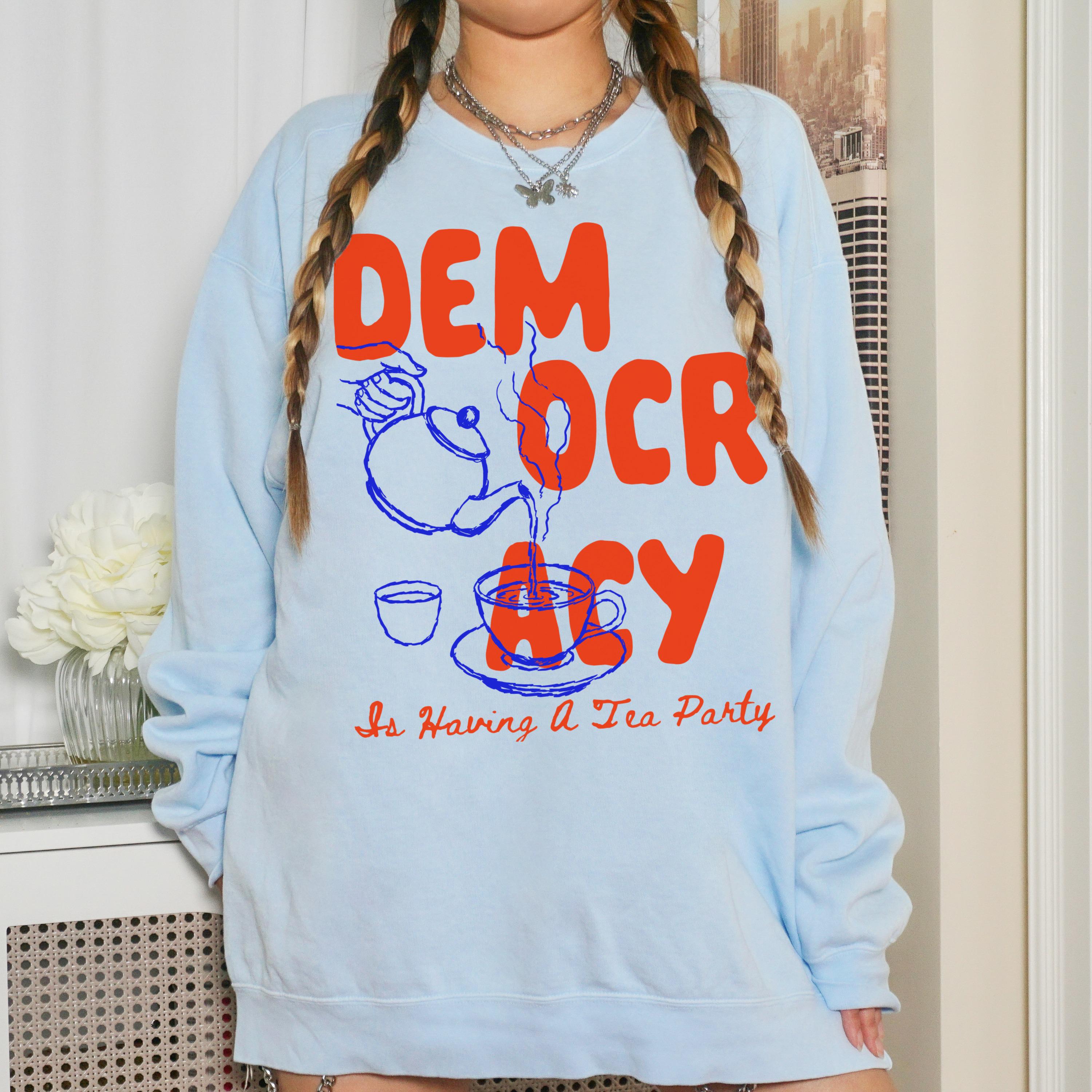 Light blue sweatshirt with &amp;quot;DEM OCRACY Is Having A Tea Party&amp;quot; graphic.