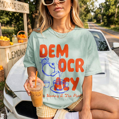 Mint green t-shirt with &amp;quot;DEM OCR ACY&amp;quot; and &amp;quot;Is Having A Tea Party&amp;quot; text.