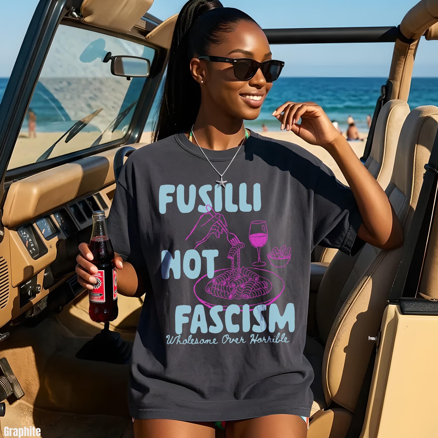 Dark gray t-shirt with text &amp;quot;Fusilli Not Fascism Wholesome Over Horrible&amp;quot; and an illustration of pasta.