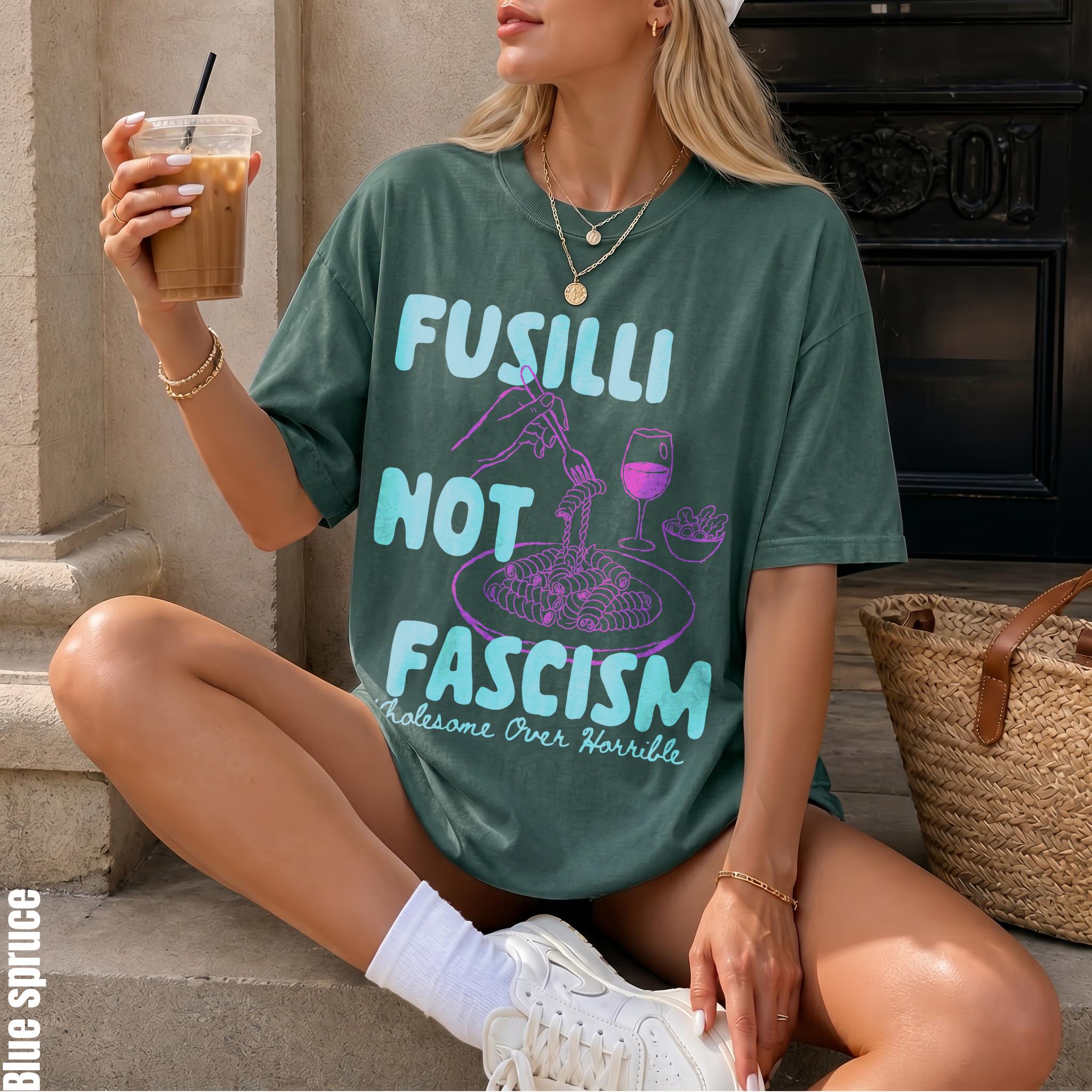 Green t-shirt with &amp;quot;Fusilli Not Fascism, Wholesome Over Horrible&amp;quot; text and pasta illustration.