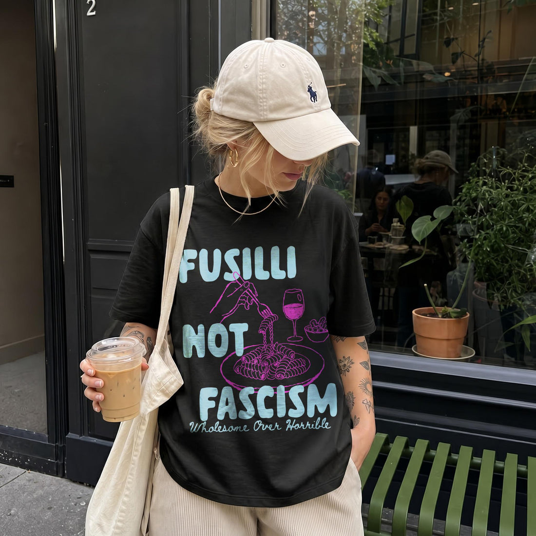 Black t-shirt with &amp;quot;Fusilli Not Fascism Wholesome Over Horrible&amp;quot; text and pasta graphic.