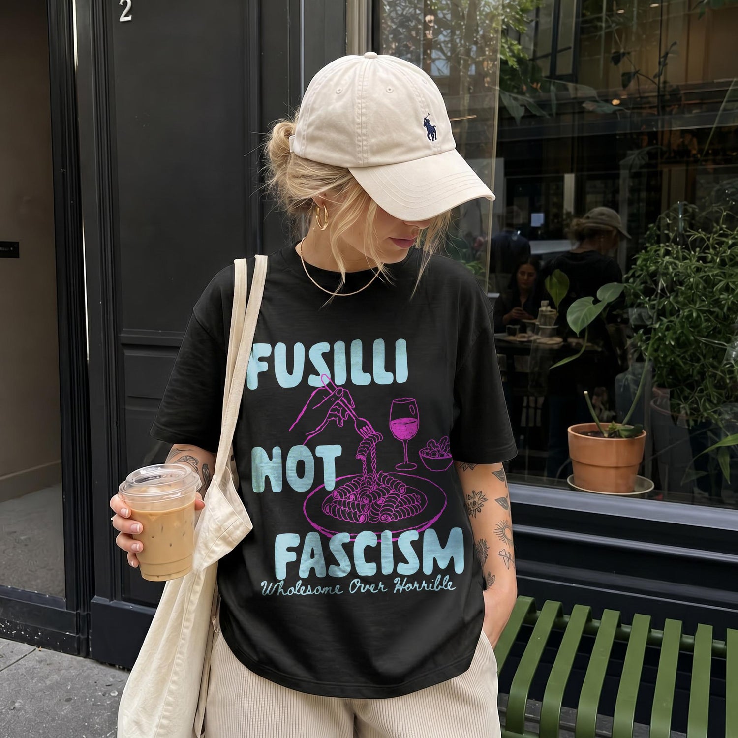 Black t-shirt with &amp;quot;Fusilli Not Fascism Wholesome Over Horrible&amp;quot; text and pasta graphic.