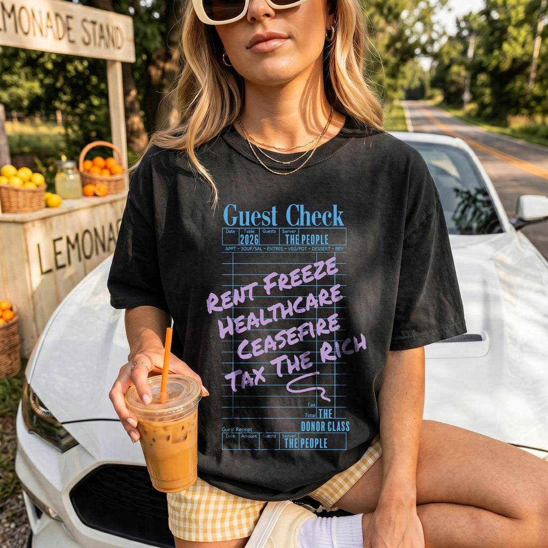 T-shirt with &amp;quot;Guest Check&amp;quot; graphic listing &amp;quot;Rent Freeze,&amp;quot; &amp;quot;Healthcare,&amp;quot; &amp;quot;Ceasefire,&amp;quot; and &amp;quot;Tax the Rich.&amp;quot;