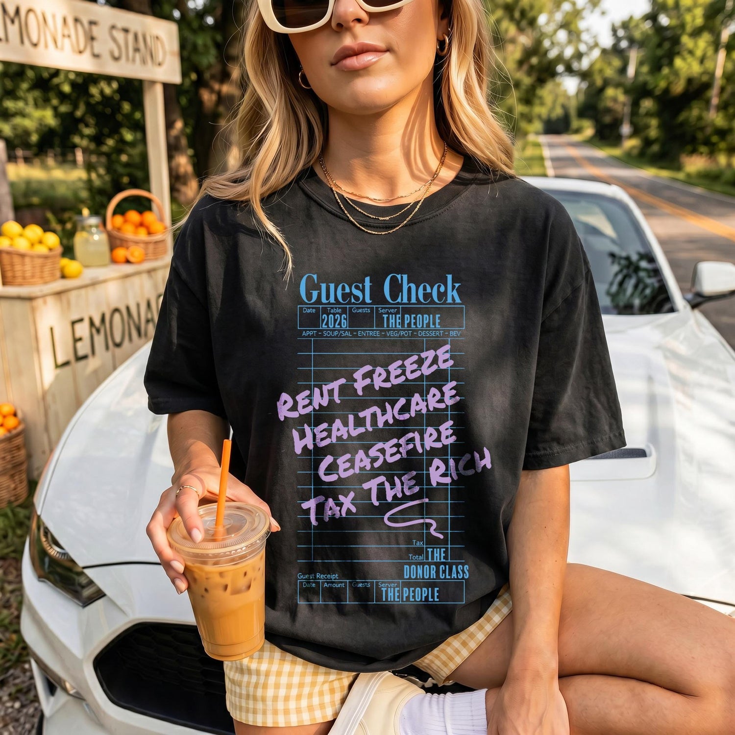 T-shirt with &amp;quot;Guest Check&amp;quot; graphic listing &amp;quot;Rent Freeze,&amp;quot; &amp;quot;Healthcare,&amp;quot; &amp;quot;Ceasefire,&amp;quot; and &amp;quot;Tax the Rich.&amp;quot;