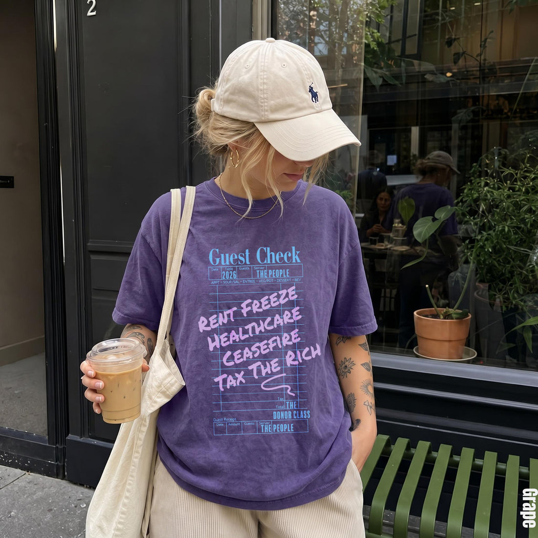 Purple t-shirt with &amp;quot;Guest Check&amp;quot; print and political slogans.