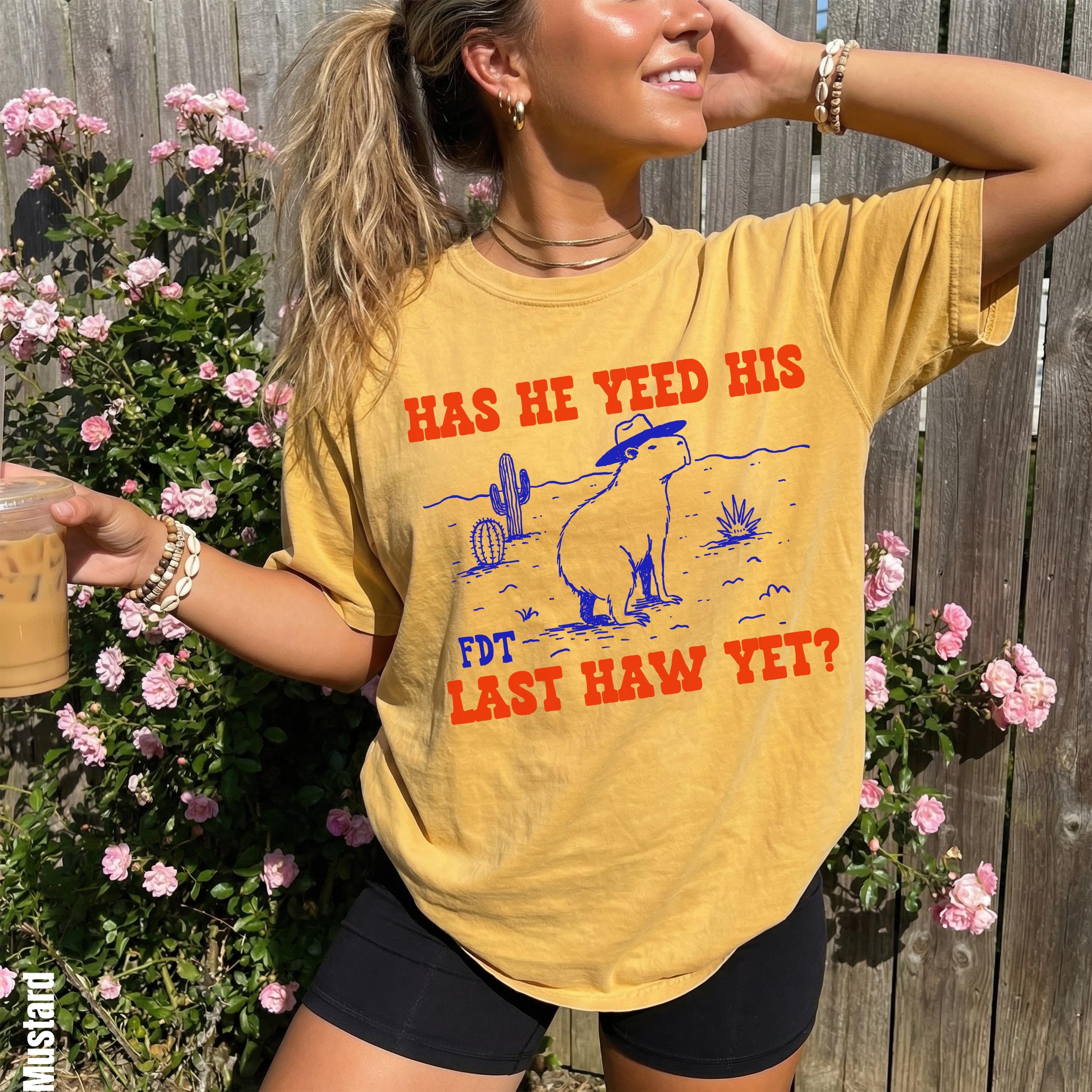 Yellow t-shirt with a desert graphic and text &amp;quot;HAS HE YEED HIS FDT LAST HAW YET?&amp;quot;