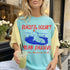Aqua t-shirt with graphic of capybara in water and text "Peaceful Doesn&