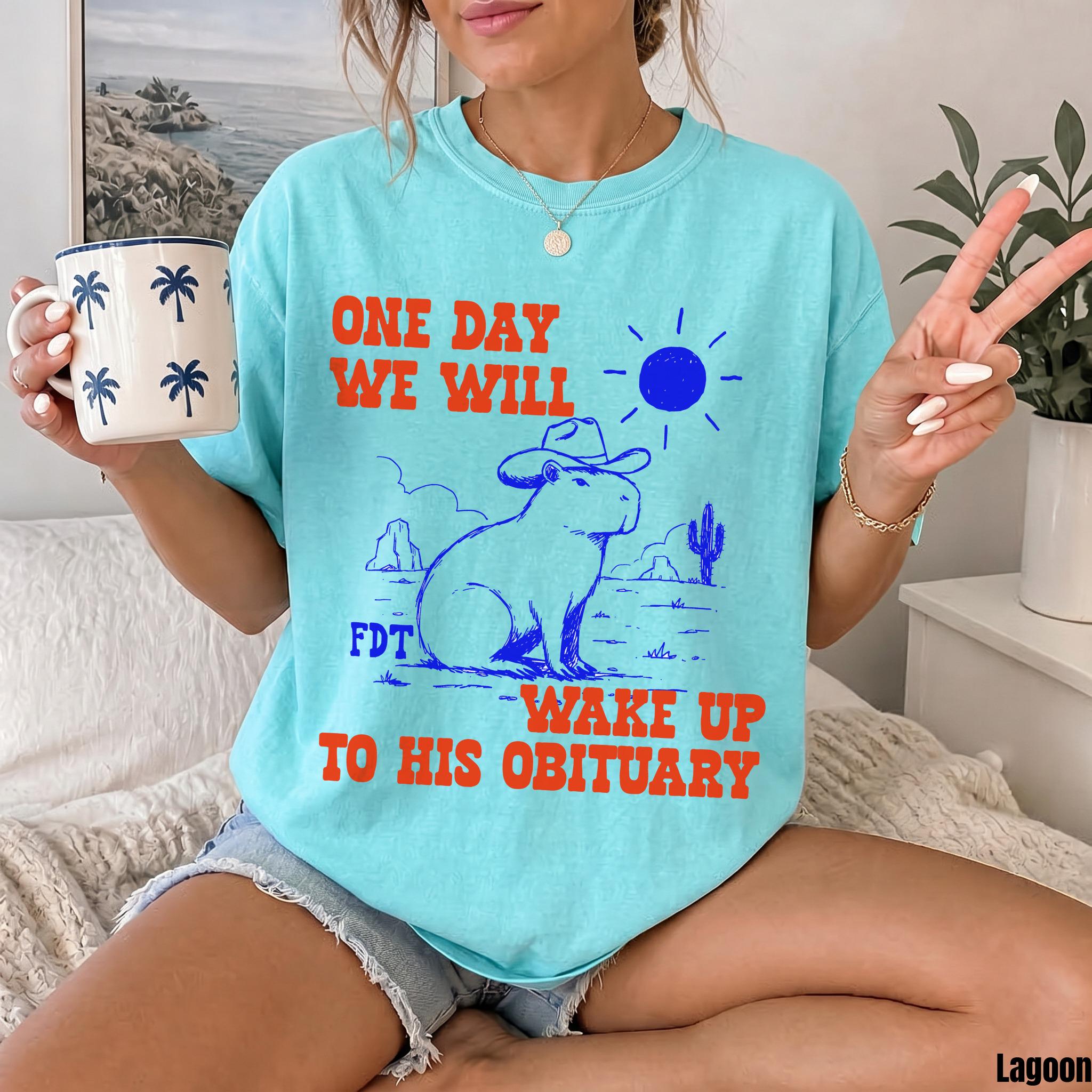 Aqua t-shirt with capybara in cowboy hat graphic and bold text.