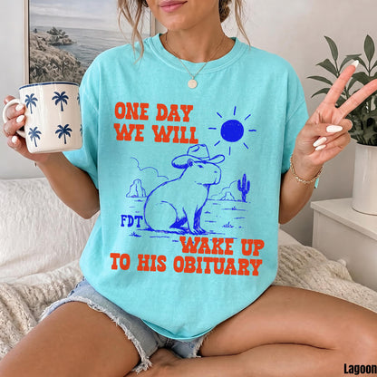 Aqua t-shirt with capybara in cowboy hat graphic and bold text.