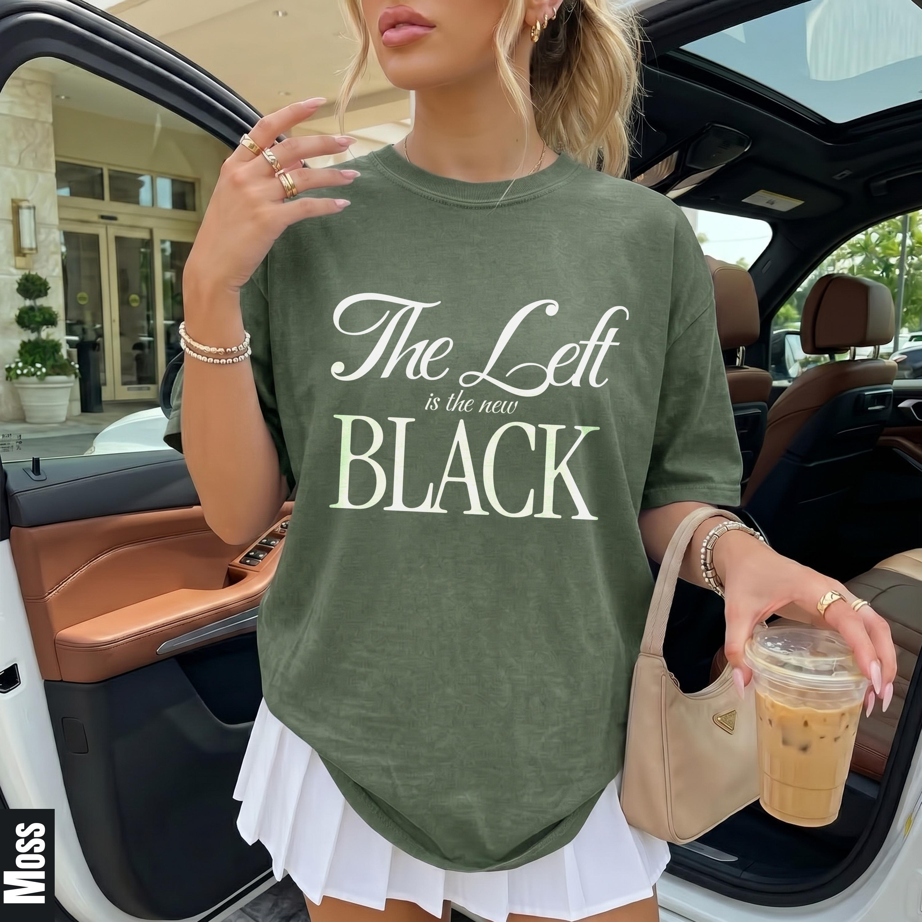 Green t-shirt with &amp;quot;The Left is the new BLACK&amp;quot; slogan over white pleated skirt.