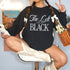 Black sweatshirt with white text "The Left is the new BLACK," worn by a person with pigtails.