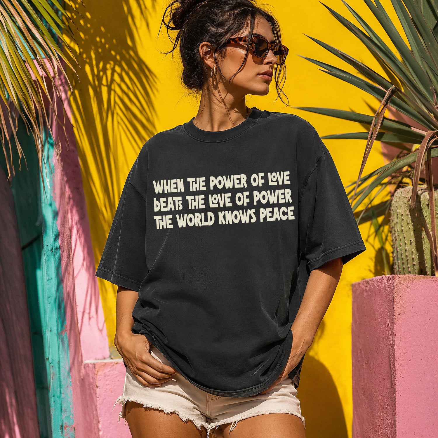 Dark t-shirt with white text reading &amp;quot;When the power of love beats the love of power the world knows peace.&amp;quot;