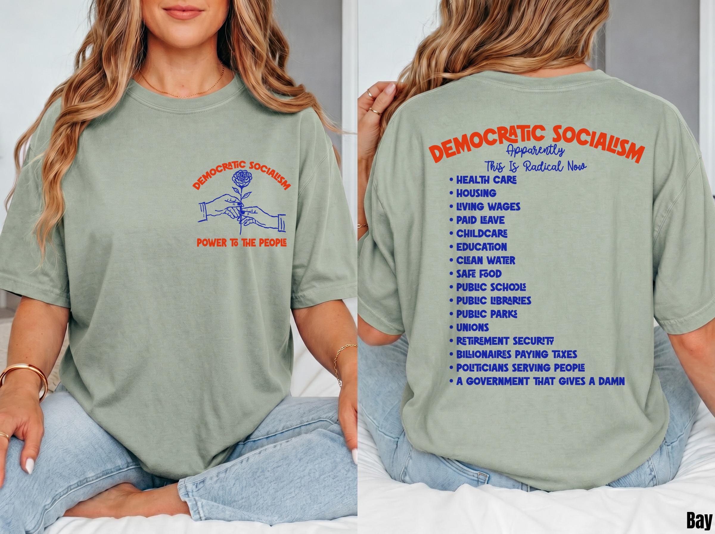 Sage green t-shirt with &amp;quot;Democratic Socialism&amp;quot; in blue and red text on front and back.