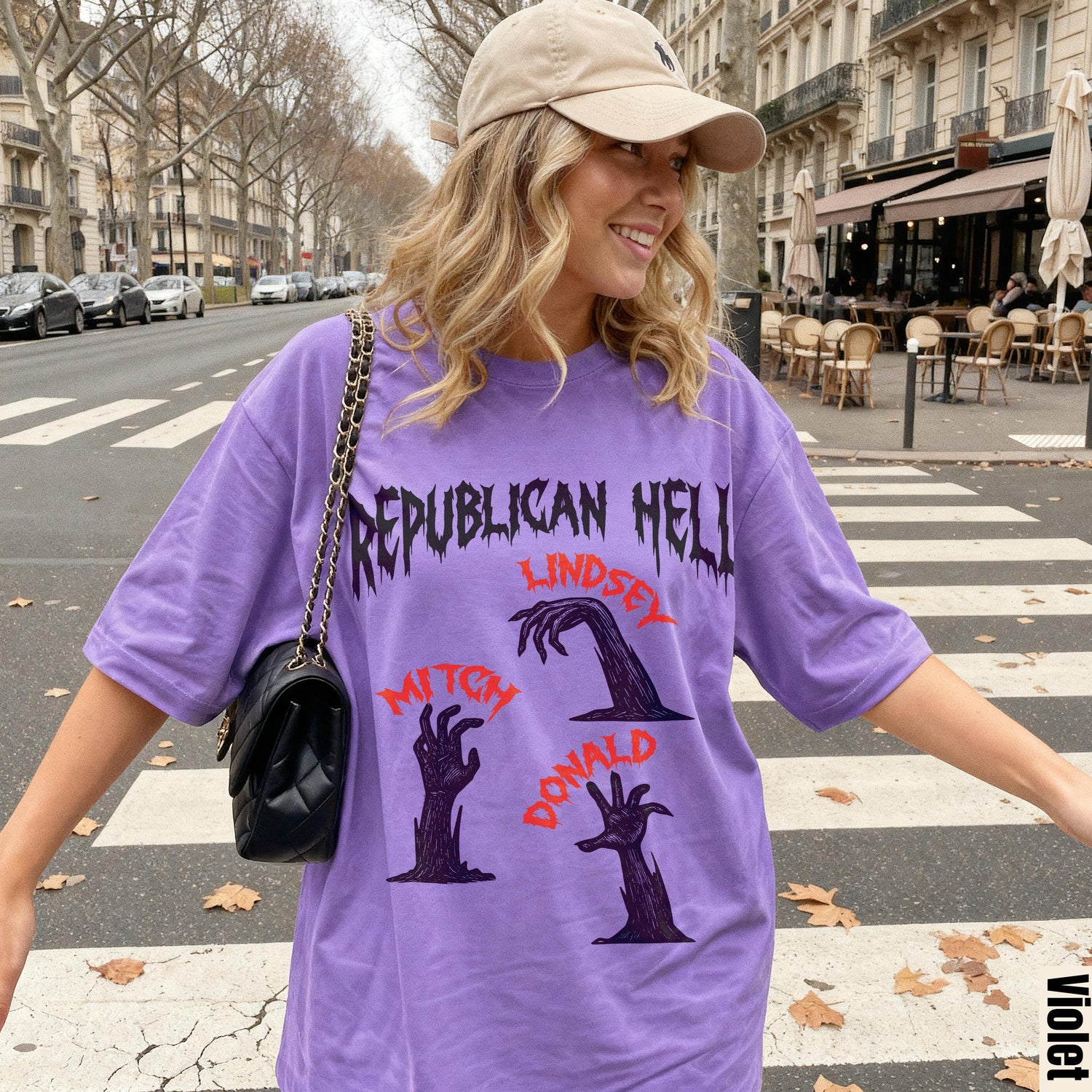 Woman wearing purple t-shirt with &amp;quot;Republican Hell&amp;quot; and zombie hands print.