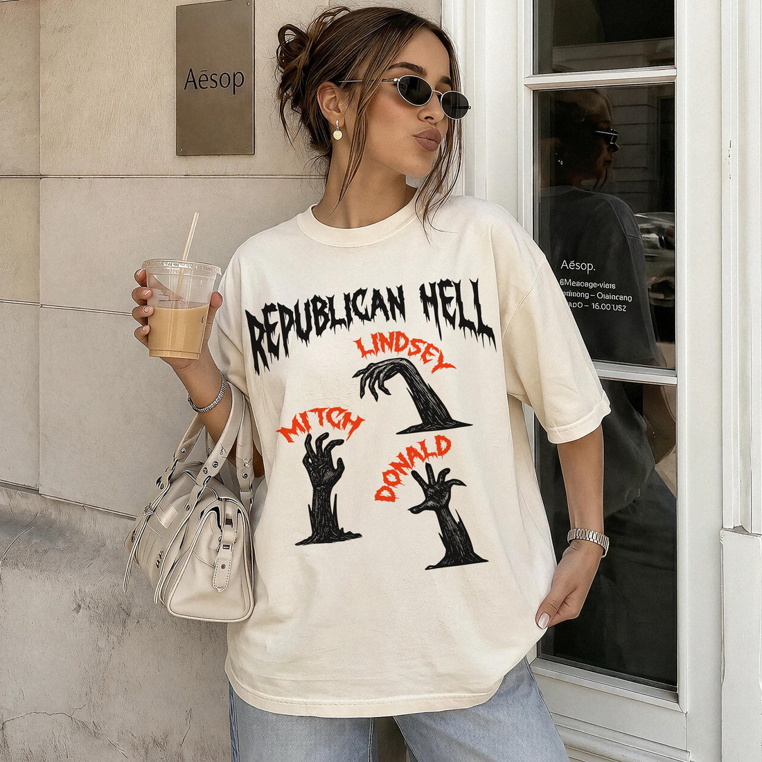 Cream t-shirt with black and red &amp;quot;Republican Hell&amp;quot; graphic featuring hands.