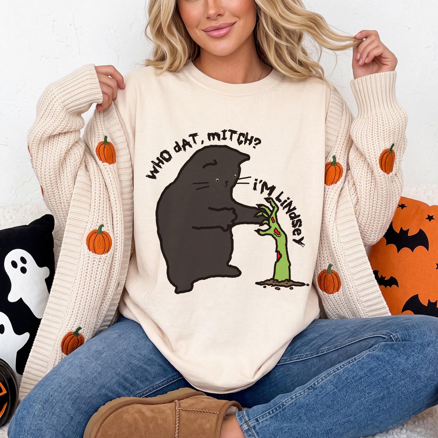 Black cat on a beige shirt with text &amp;quot;WHO DAT, MITCH? I&amp;