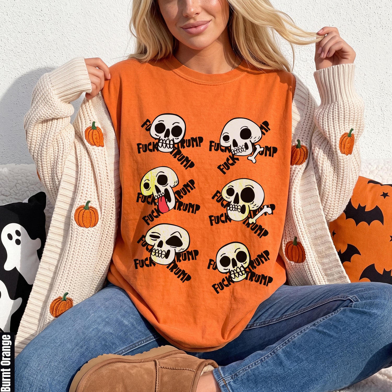 Orange t-shirt with skulls saying &amp;quot;Fuck Trump&amp;quot; and pumpkins on a cardigan.
