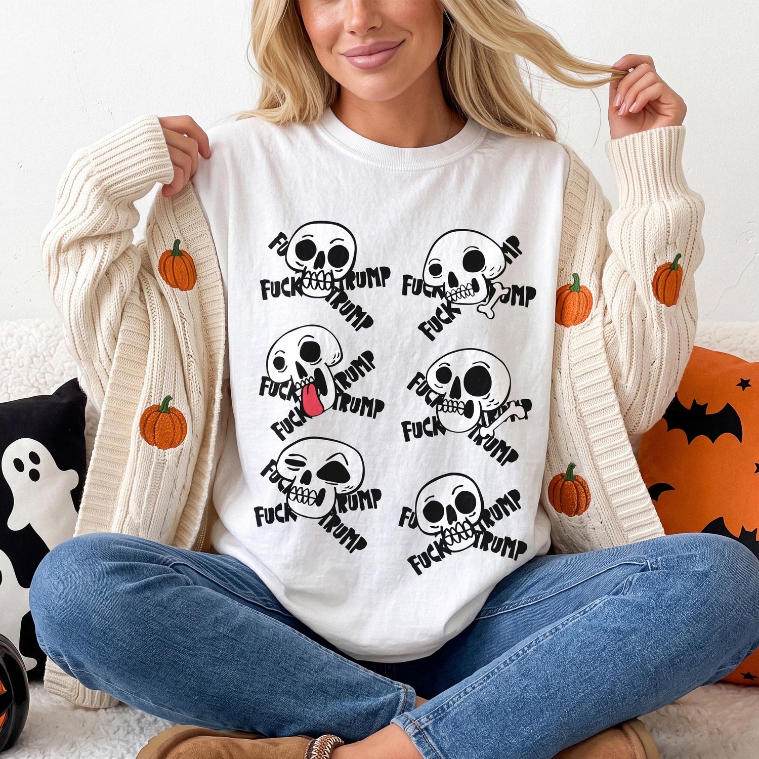 White t-shirt with six skulls and the text &amp;quot;Fuck Trump&amp;quot;.