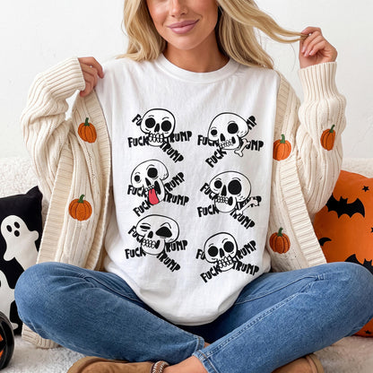 White t-shirt with repeated graphic of skulls and text &amp;quot;Fuck Trump&amp;quot;.