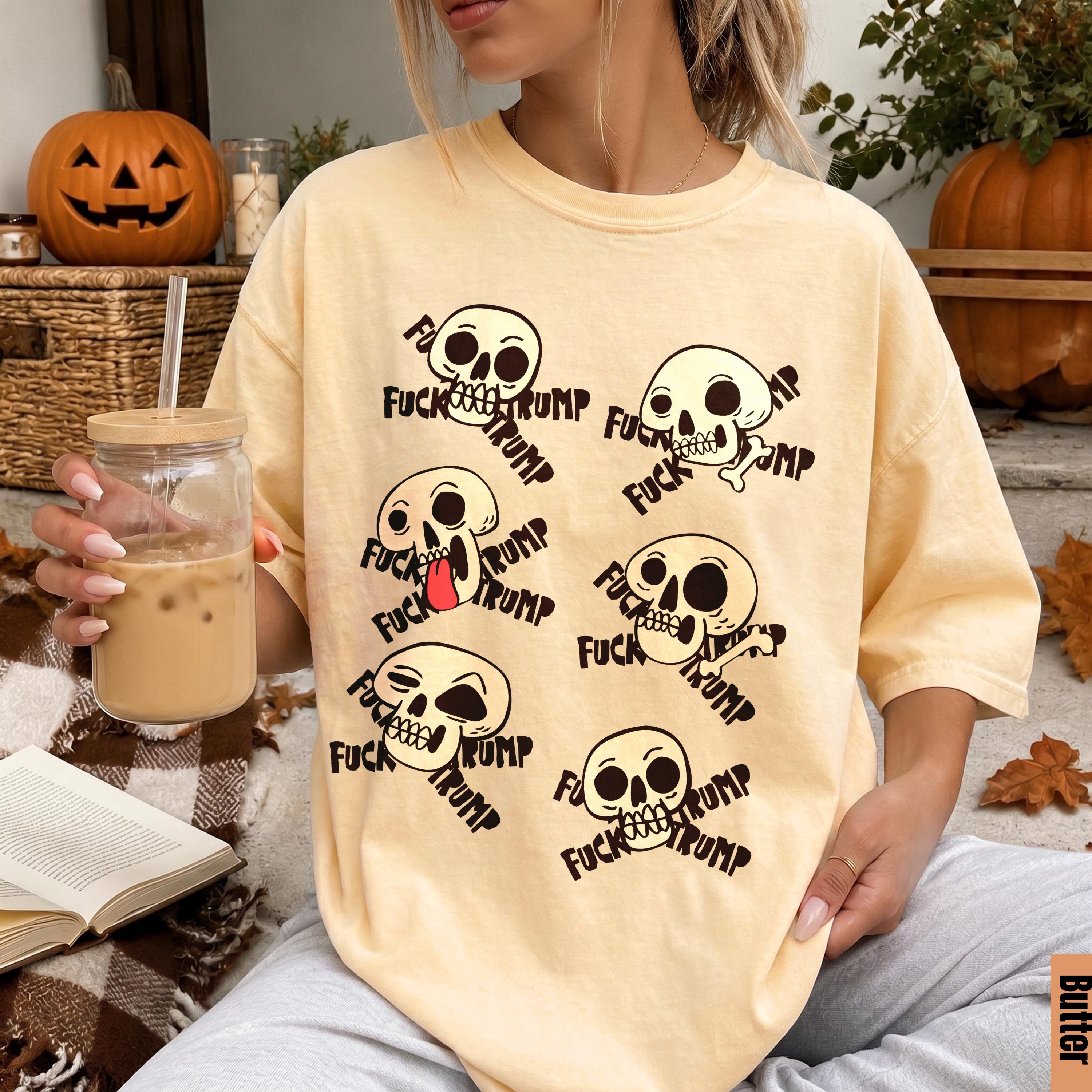 Yellow t-shirt with multiple skulls and &amp;quot;FUCK TRUMP&amp;quot; text.