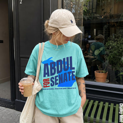 Turquoise t-shirt with &amp;quot;ABDUL FOR SENATE&amp;quot; text and campaign slogans.