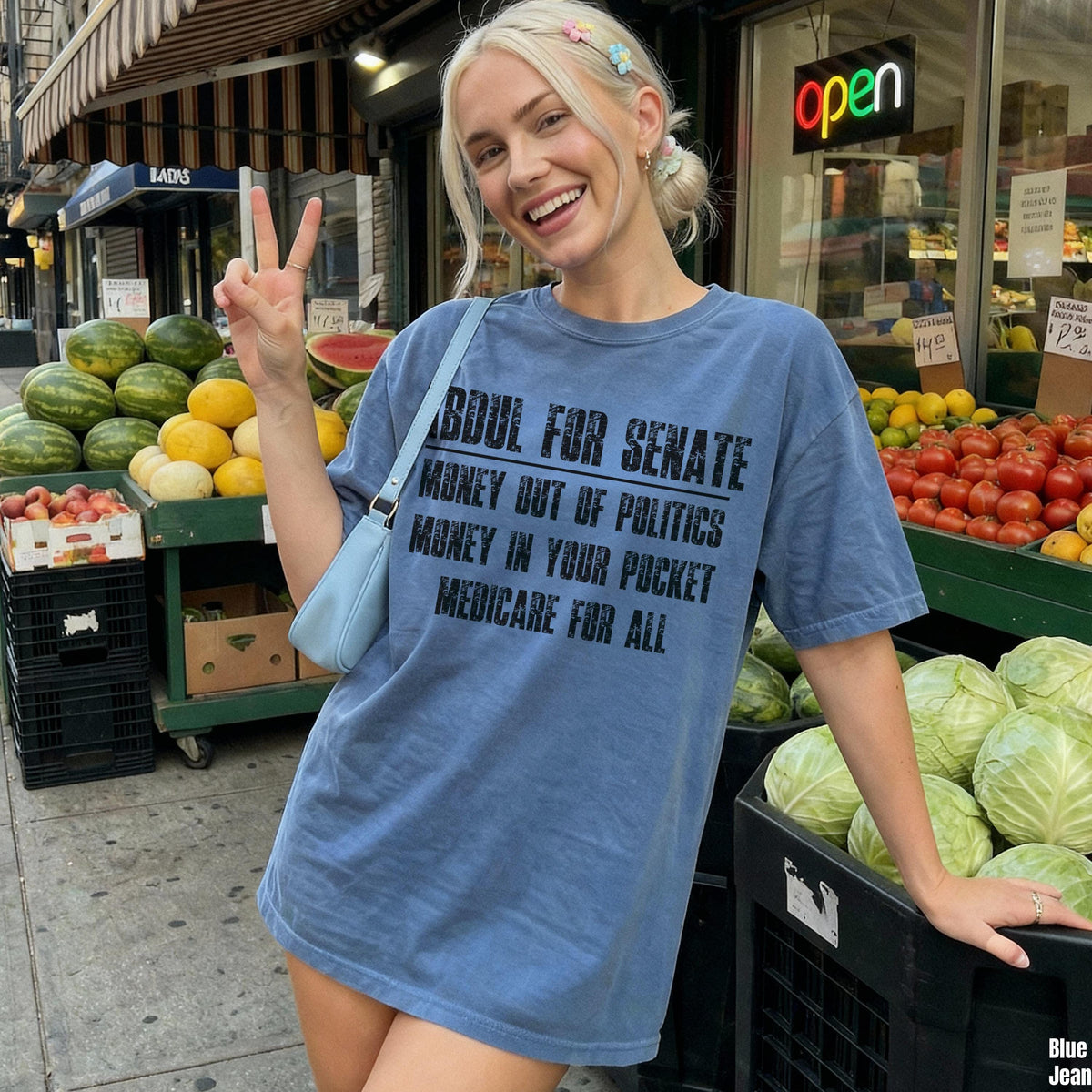 Blue t-shirt with text &amp;quot;Boul for Senate Money Out of Politics Medicare for All&amp;quot;.