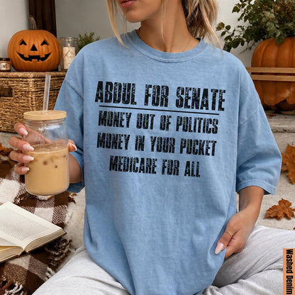 Light blue t-shirt with text: Abdul for Senate, Money Out of Politics, Money In Your Pocket, Medicare for All.