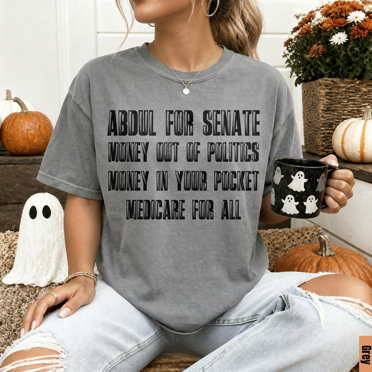 Grey t-shirt with text: ABDUL FOR SENATE, MONEY OUT OF POLITICS, MONEY IN YOUR POCKET, MEDICARE FOR ALL.