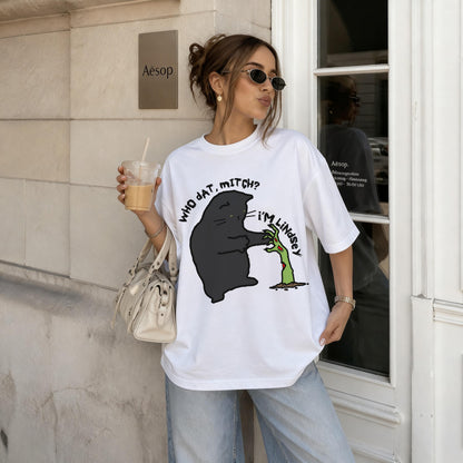 White t-shirt with cartoon black cat and zombie hand graphic text &amp;quot;who dat, mitch? i&amp;