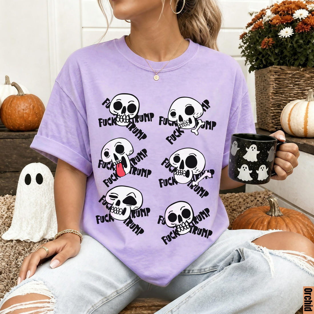 Purple t-shirt with repeating skull graphic and &amp;quot;fuck trump&amp;quot; text.