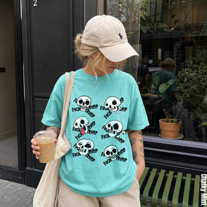 Turquoise t-shirt with multiple skull graphics and the text &amp;quot;FUCK TRUMP&amp;quot;.