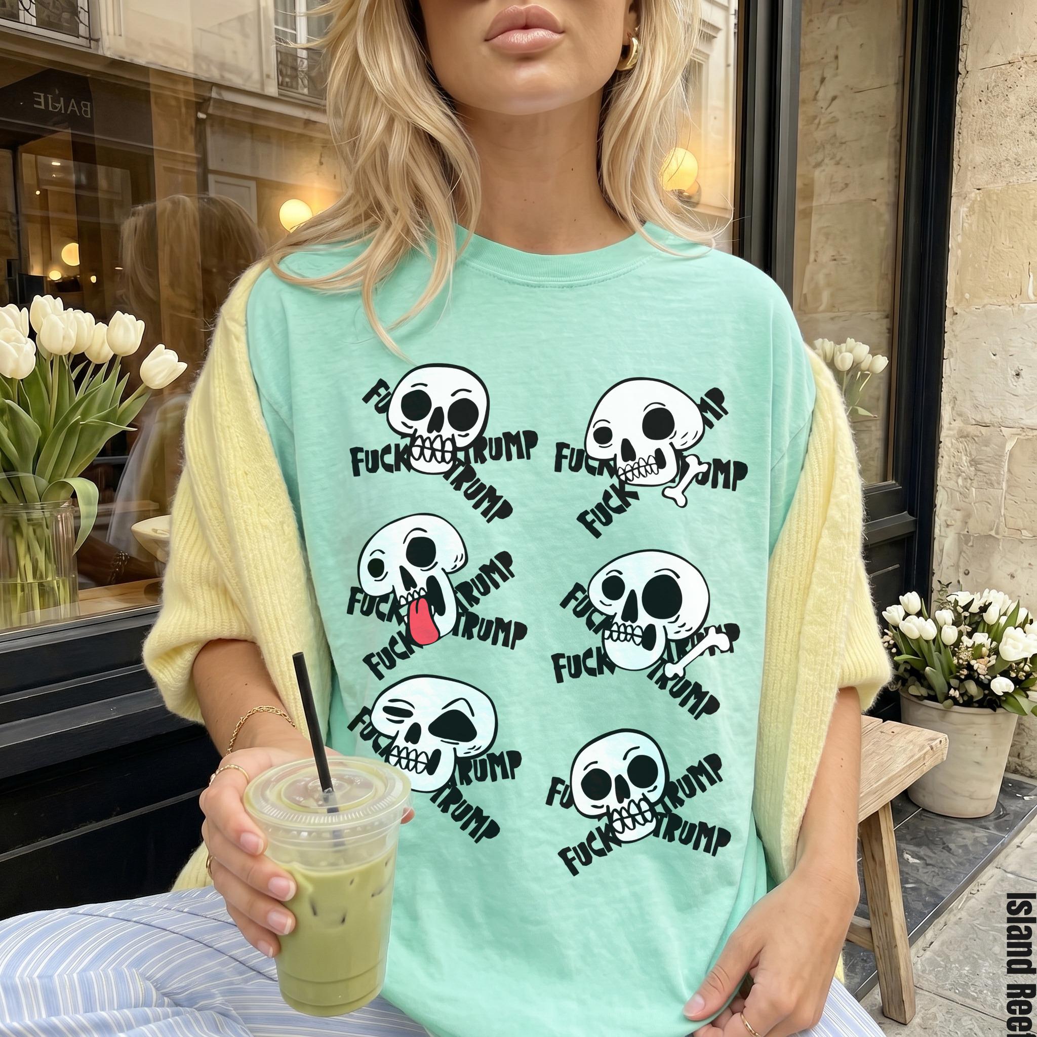 Mint green t-shirt with repeated skull graphics and &amp;quot;FUCK TRUMP&amp;quot; text.