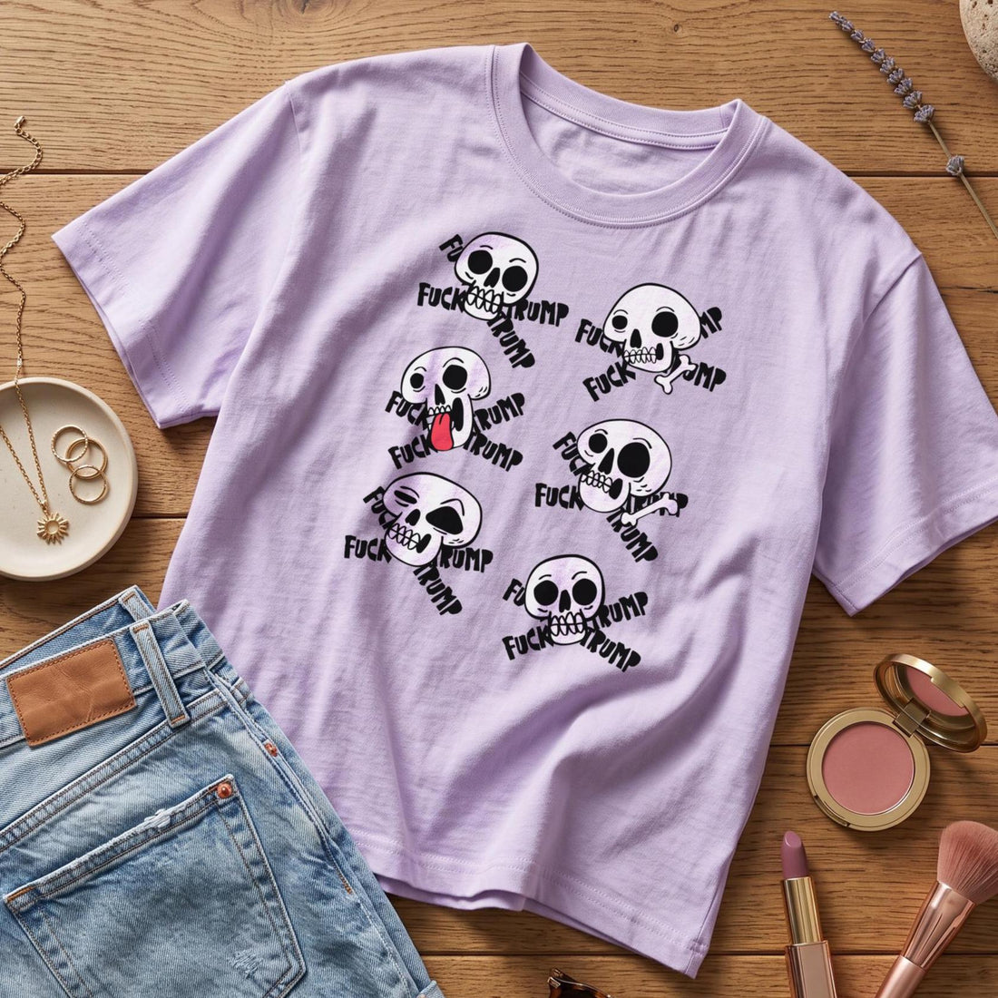 Lilac t-shirt with multiple skull graphics and &amp;quot;FUCK TRUMP&amp;quot; text.