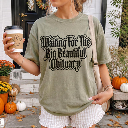 Olive green t-shirt with &amp;quot;Waiting For The Big Beautiful Obituary&amp;quot; text and ghost coffee cup.