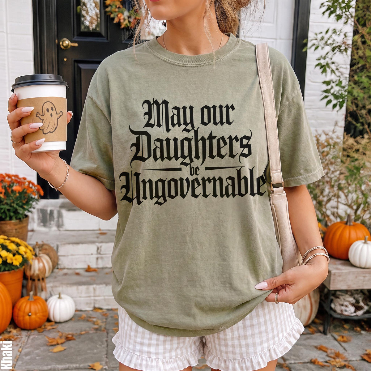 Green t-shirt with &amp;quot;May our Daughters be Ungovernable&amp;quot; text and ghost coffee cup.