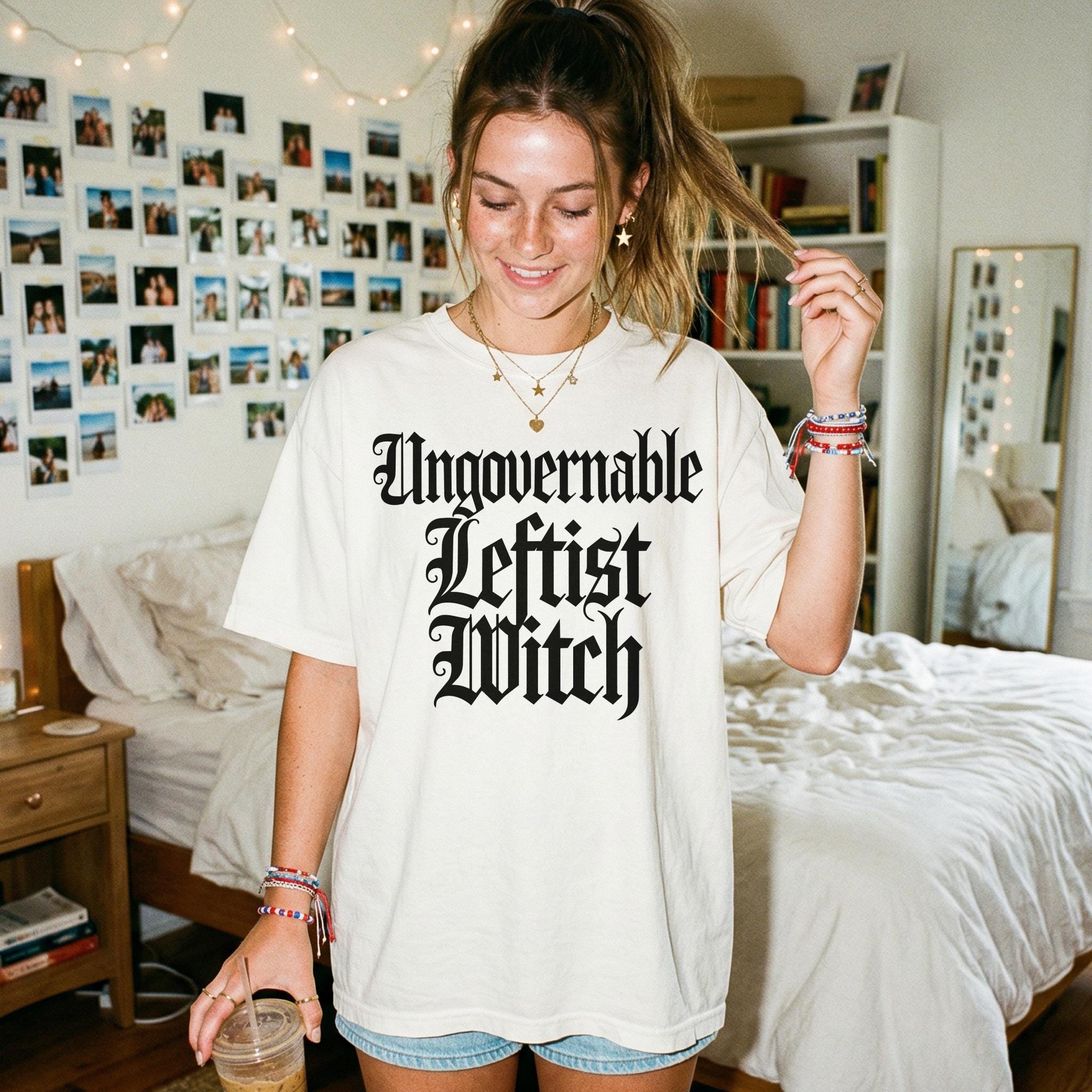 Cream t-shirt with &amp;quot;Ungovernable Leftist Witch&amp;quot; text, worn by a young woman.