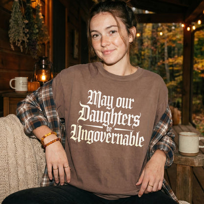 Brown t-shirt with white gothic text &amp;quot;May our Daughters be Ungovernable.&amp;quot;