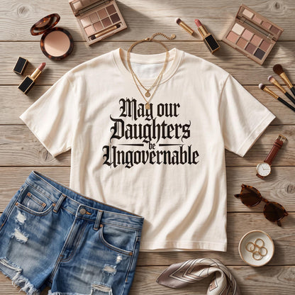 Cream t-shirt with black gothic text: &amp;quot;May our Daughters be Ungovernable&amp;quot;.