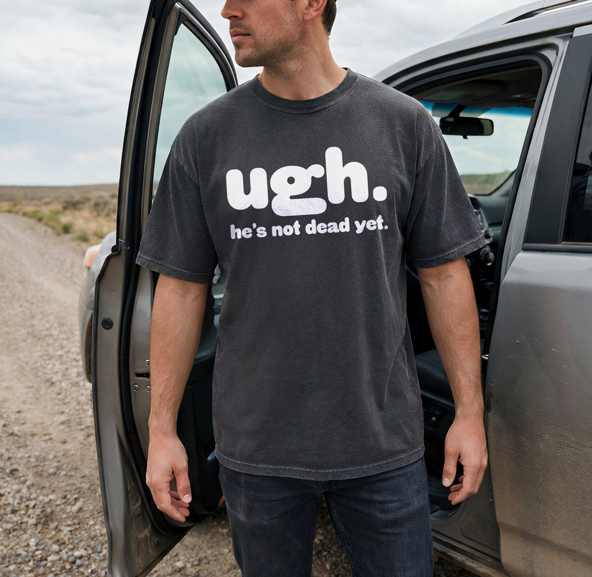 Man wearing dark t-shirt with white text &amp;quot;ugh. he&amp;