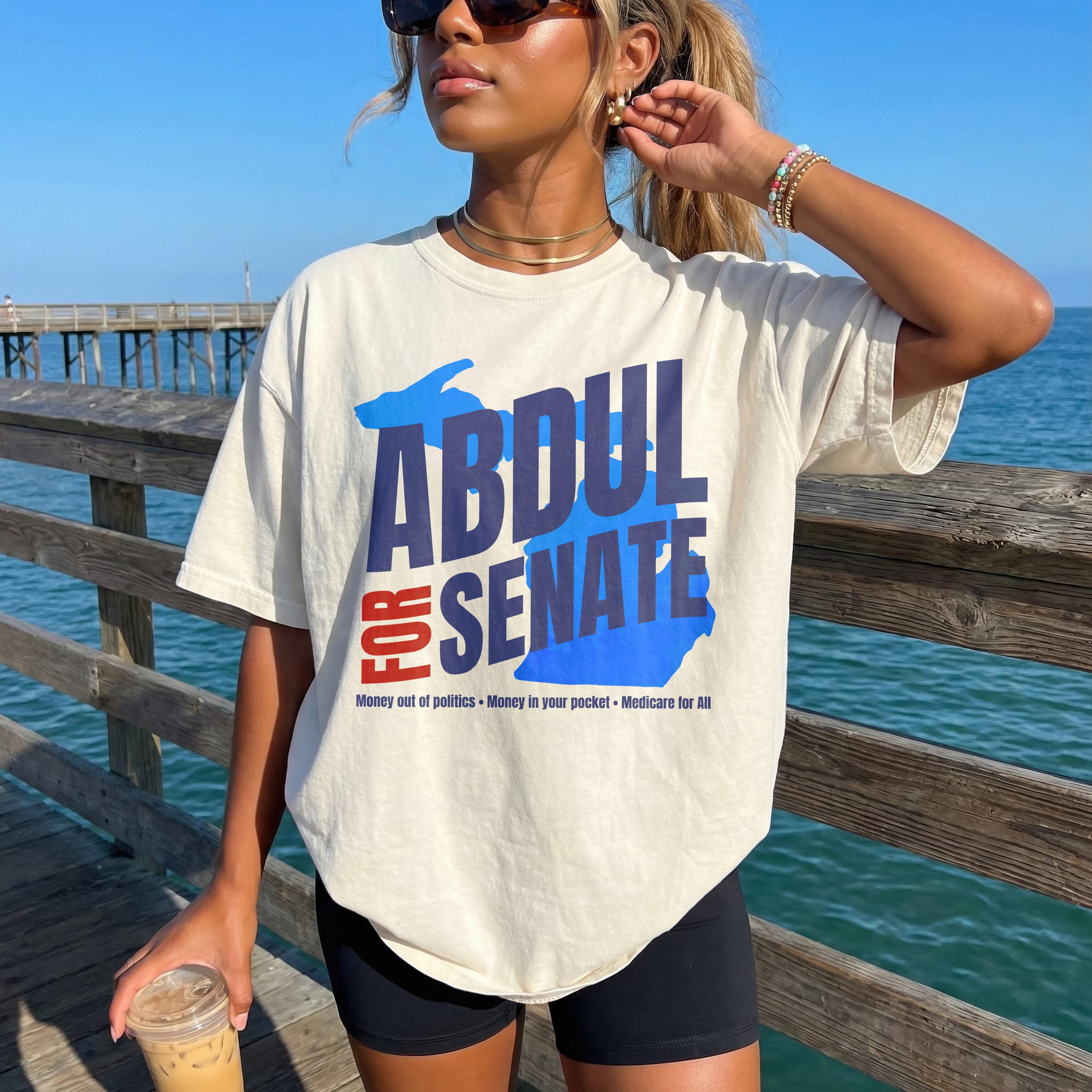 Shirt with &amp;quot;ABDUL FOR SENATE&amp;quot; in blue and red text over a Michigan-shaped graphic.