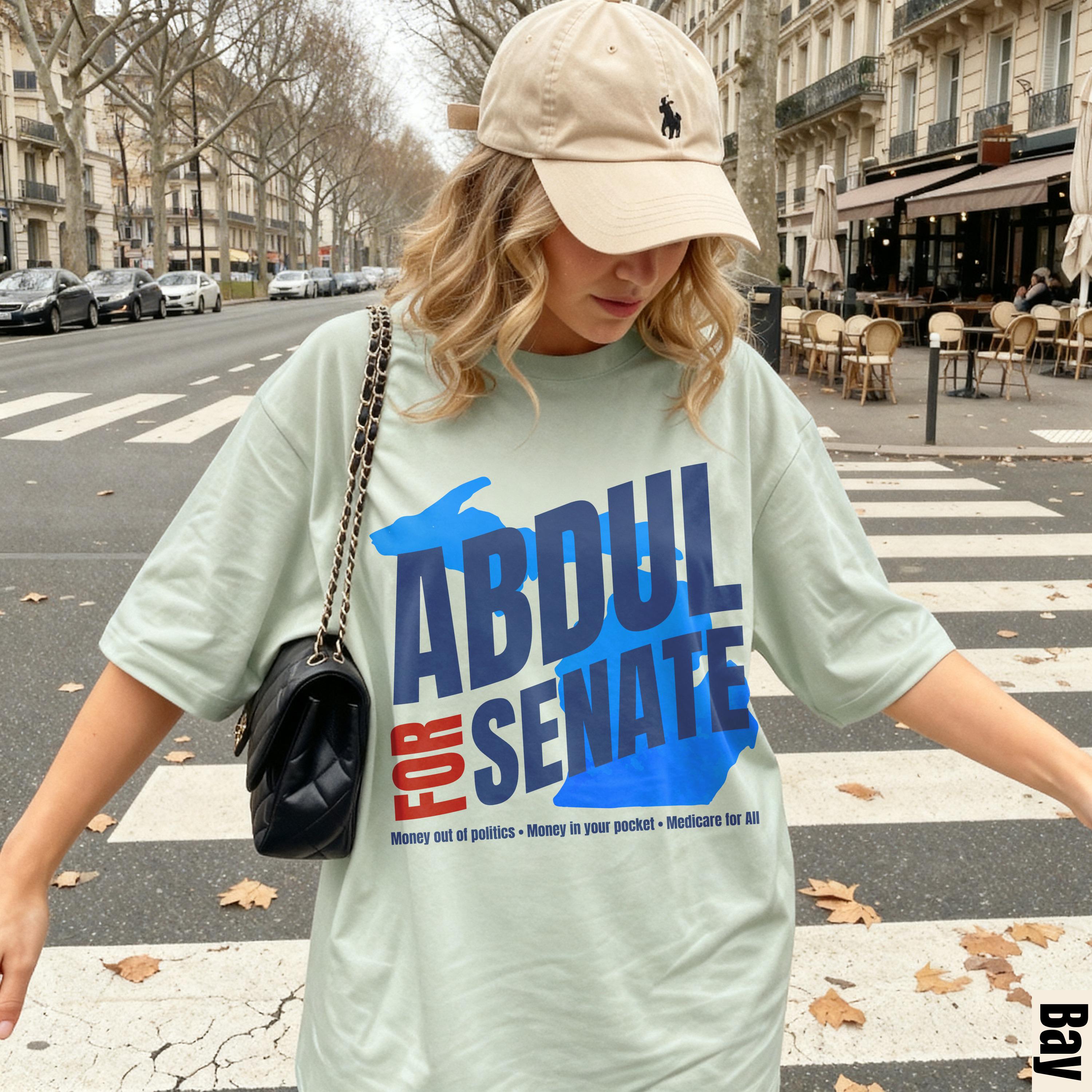 Light green t-shirt with &amp;quot;ABDUL FOR SENATE&amp;quot; text and campaign slogans.